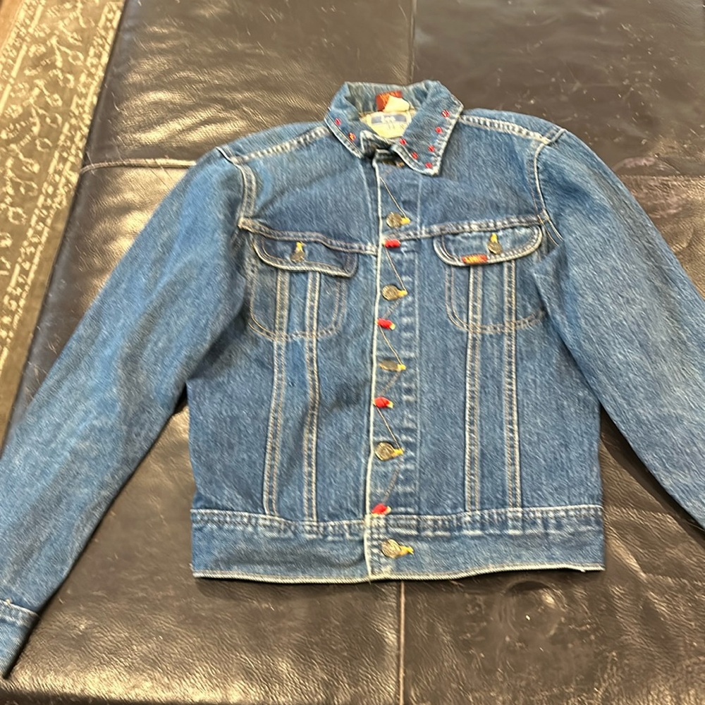 Women’s league jacket, custom touches embroidering the Virgin Mary on it